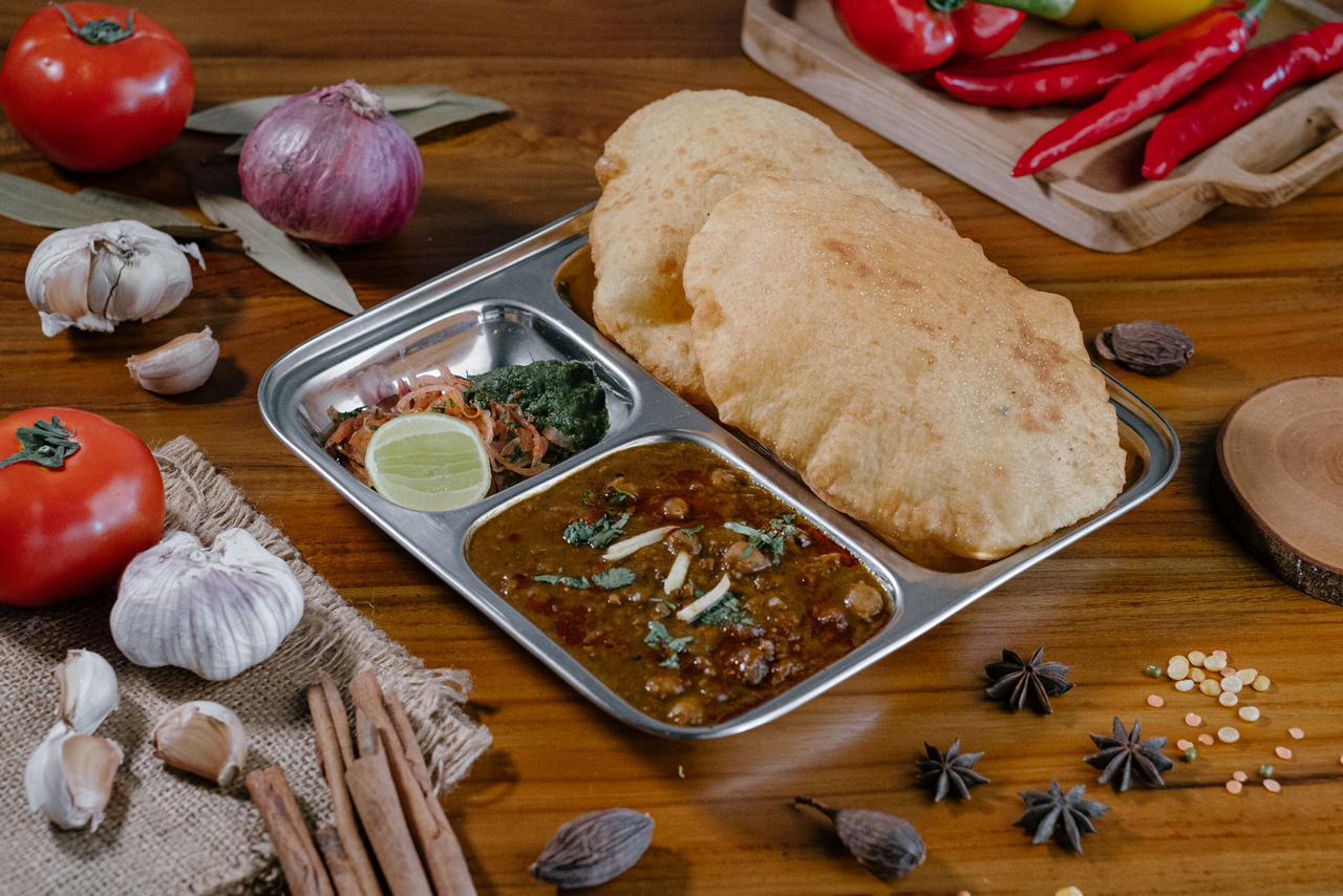 Chole Bhature — Punjabi chickpea curry with puffed fried bread