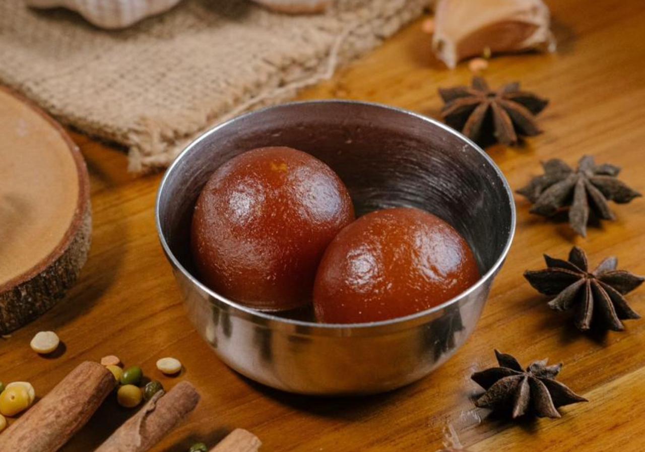 Gulab Jamun — warm Indian dessert in sugar syrup